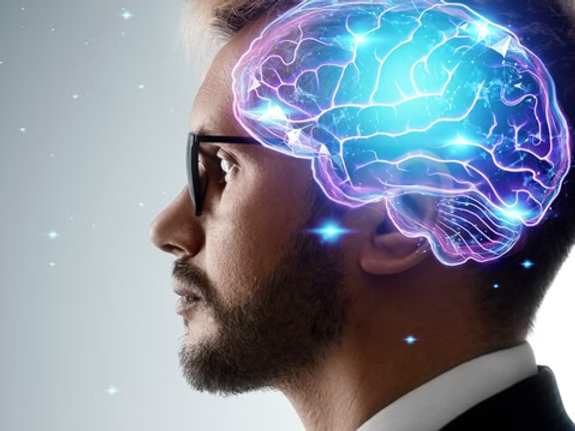 Digital illustration of a human head profile showing brain activity and the long-term effects of concussions