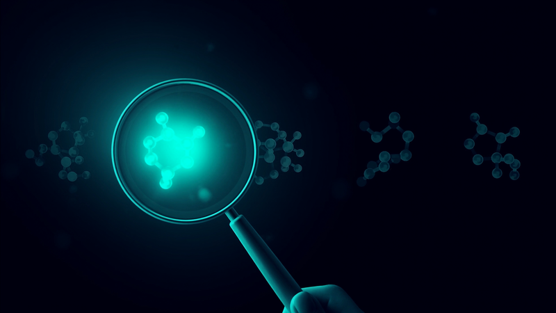 Magnifying glass examining molecular structures, illustrating how to evaluate a concussion supplement label
